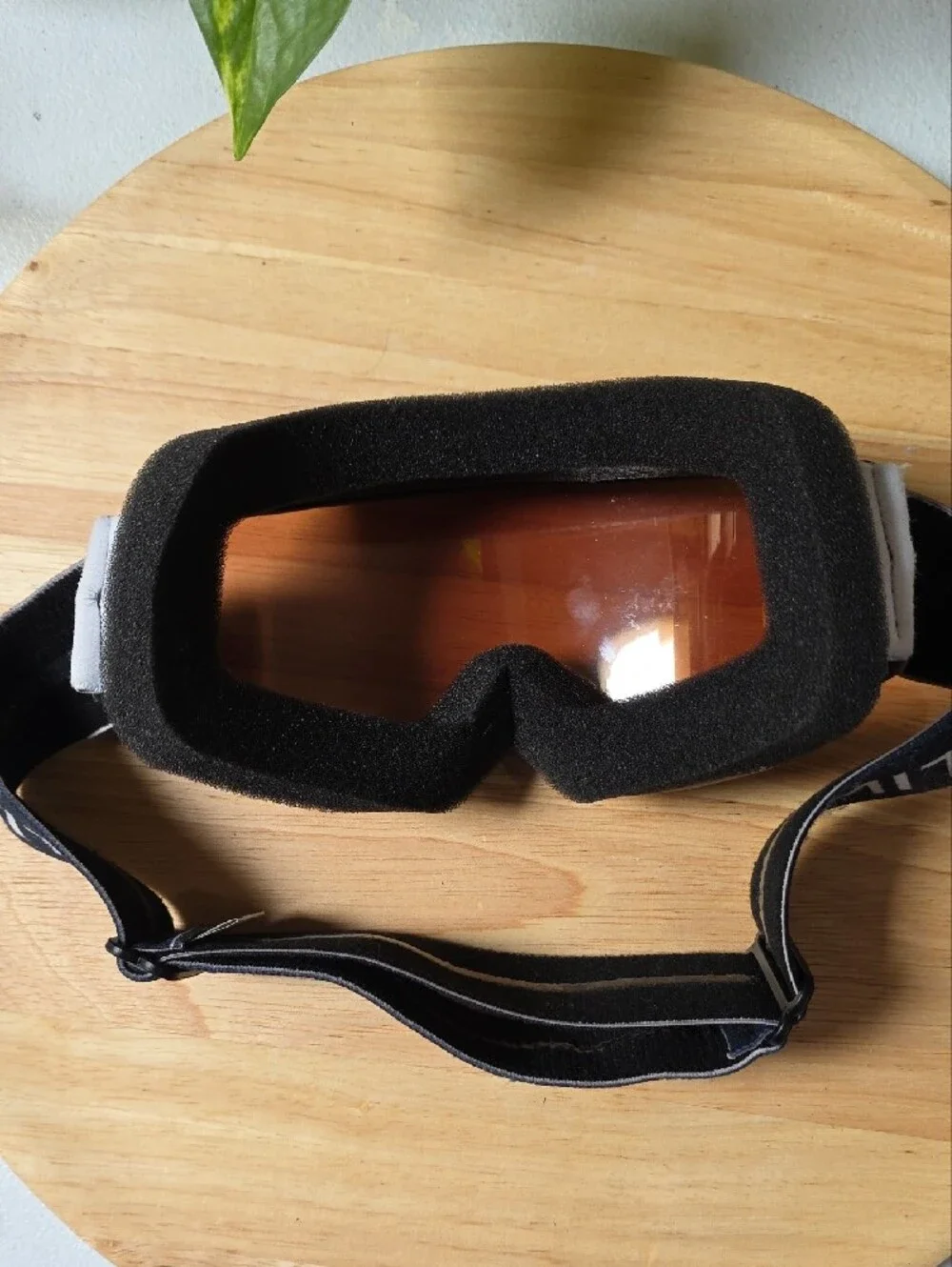 Smith Optics snow goggles featuring a black strap with white branding